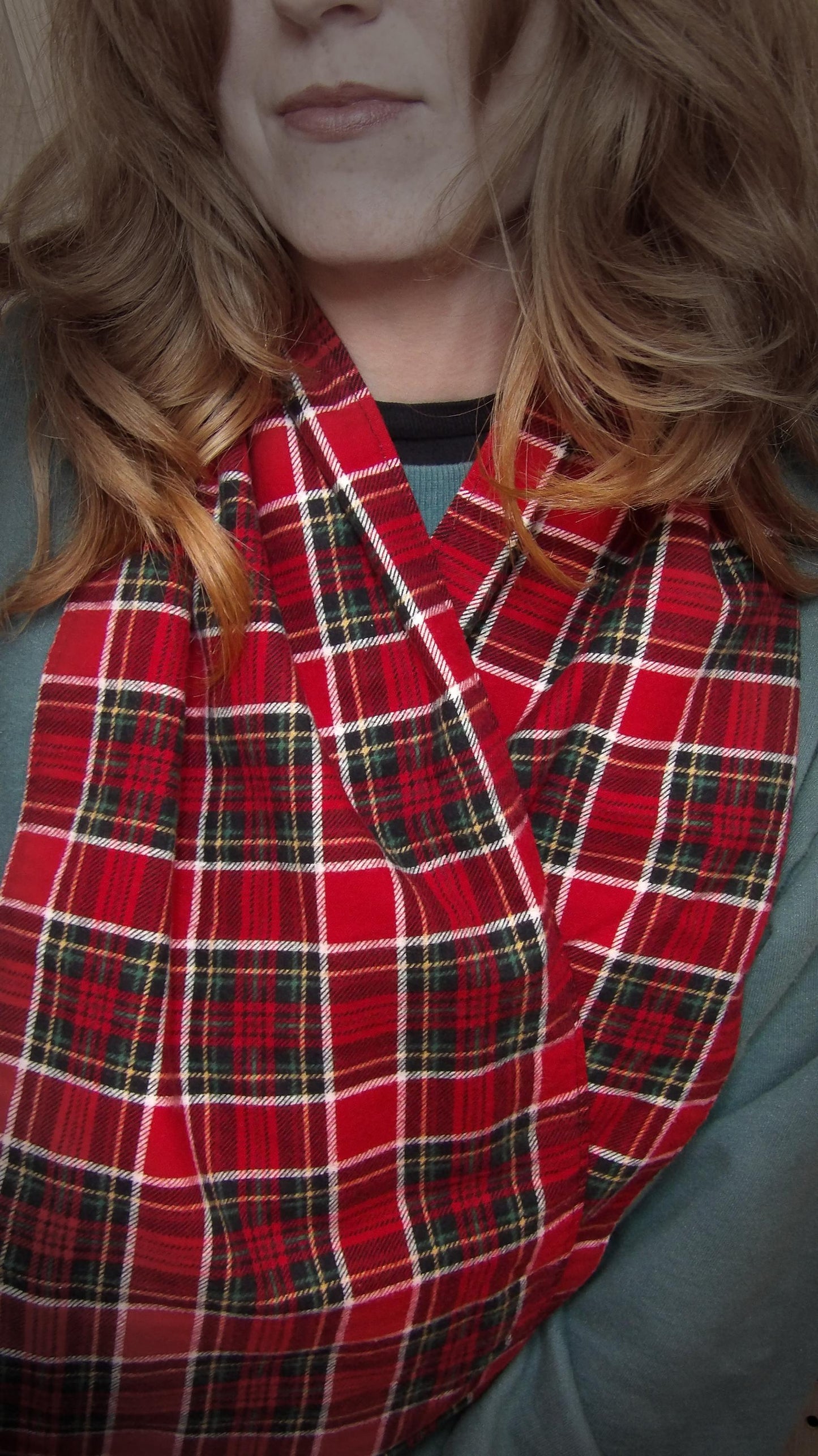 Model wearing red tartan flannel scarf made of 100% cotton. Soft, warm cotton fleece with a royal stewart inspired plaid design. Handmade in Washington State, USA