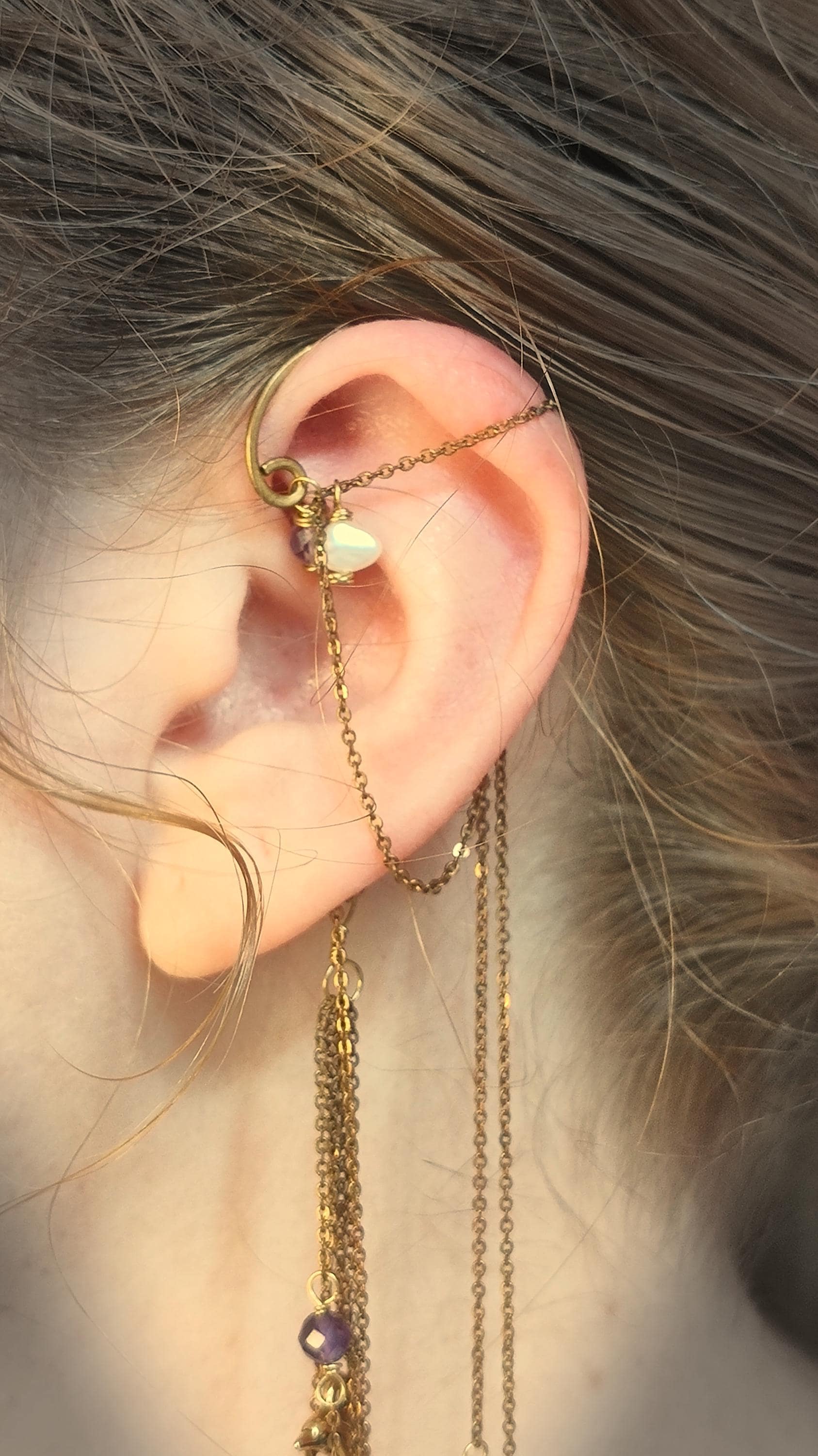 Ocean ear cuff wrap around earring with natural amethyst and baroque pearls. No piercing ear cuff features a dolphin charm and natural shell accent.